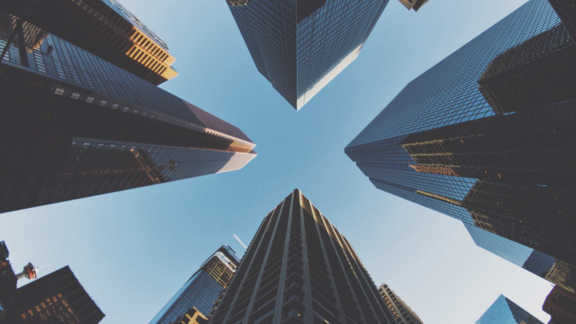 Low-angle view of downtown skyscrapers against sky